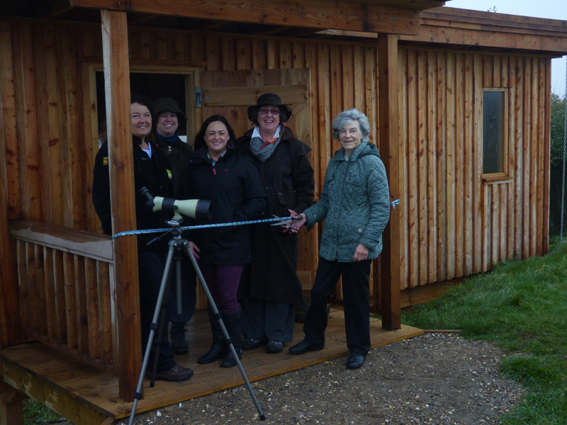 Lady Rose Crossman opens the new bide with representatives from Peregrini Lindisfarne and Natural England